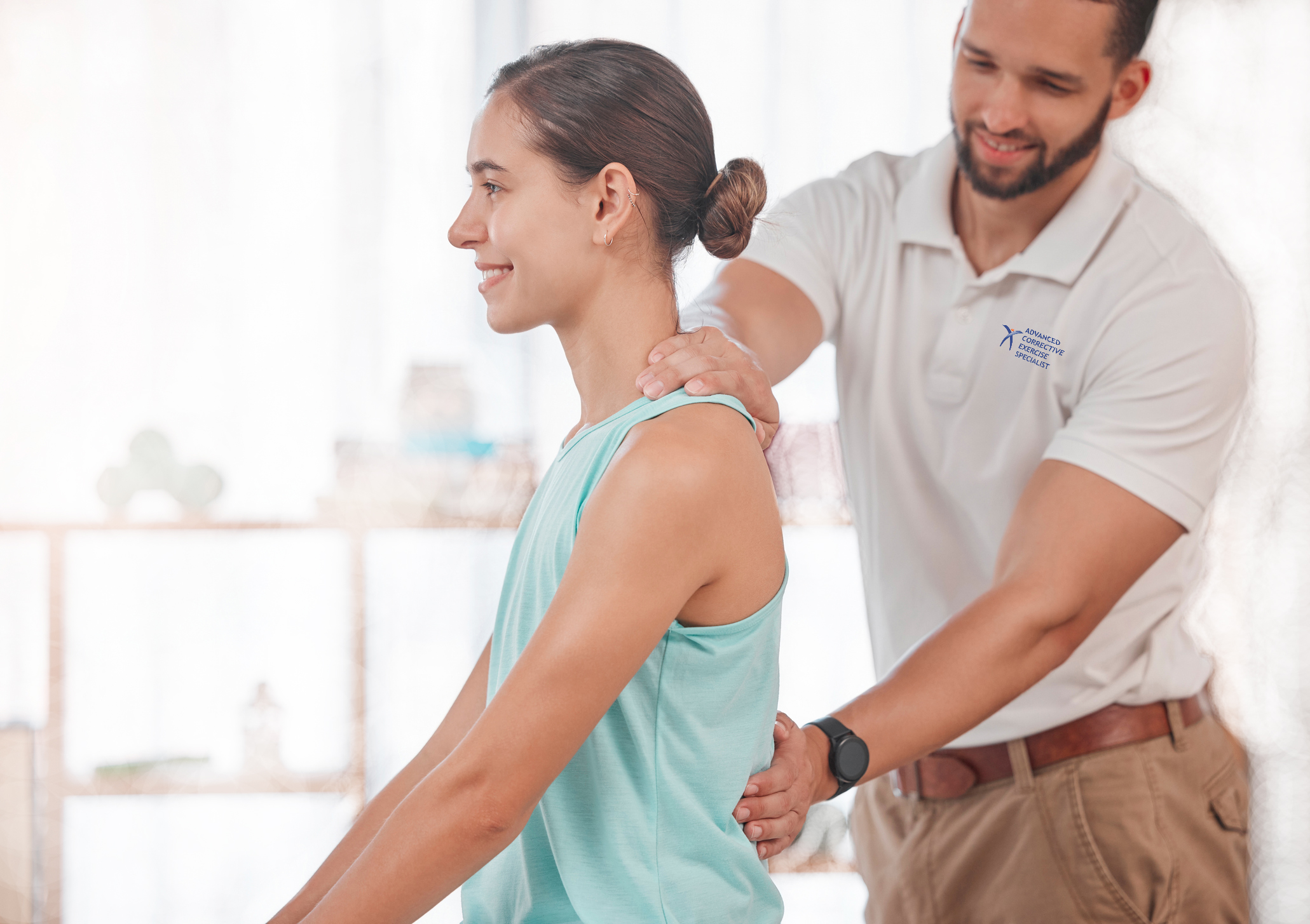 Physiotherapy, Chiropractor And Consulting With Woman And Doctor For Healthcare, Medical Or Sports Therapy. Healing, Wellness And Training With Spine Of Patient And Man Help For Back Injury Exam